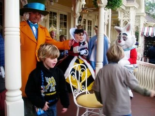 The Mad Hatter plays off the final round of Musical Chairs at Disneyland.
