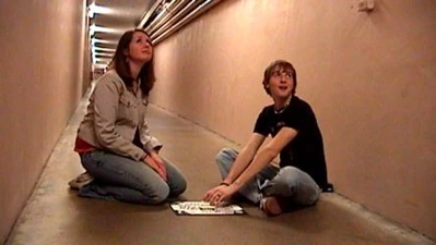 Samantha Olson and Shane Zahrt have just made contact with the ghost using their Ouija board in The Tunnel