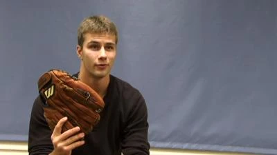 An enthusiastic baseball fan (Brock Berglund) shows the glove he almost caught an historic ball with in Splendid Splinters.
