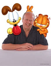 Jim Davis with Odie on the left and Garfield on the right