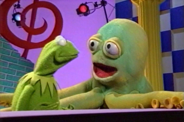 Otto gets the squeeze on Kermit.