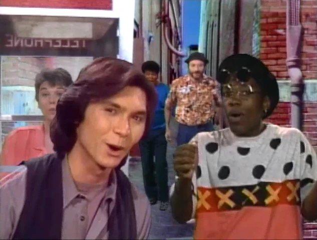 Lou Diamond Phillips, foreground left, with Tyne Daly, Robin Williams, Kadeem Hardison, and others in "Monster in the Mirror"