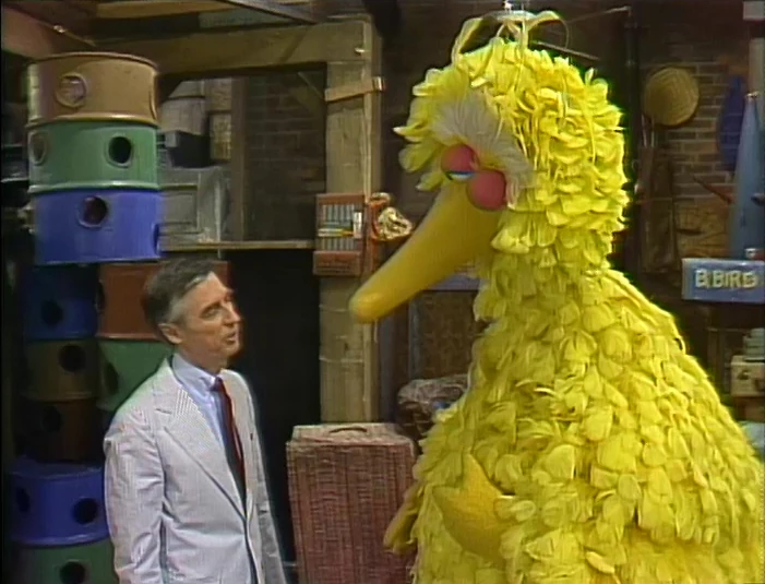 Mr. Rogers and Big Bird.