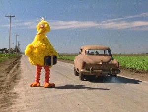 Big Bird, on his way to New York City to break into public television (in The Muppet Movie).