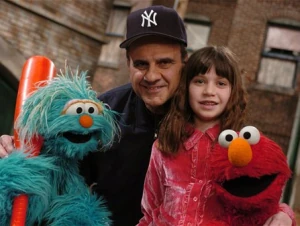 Joe Torre, center, with Rosita, daughter Andrea, and Elmo