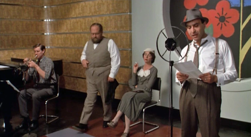 The cast of an American radio drama, as depicted in Dreamchild