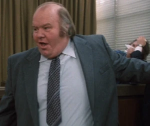 Thick Wilson as the prosecutor in Strange Brew