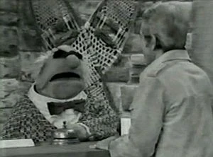 Perry tries to check in with King Goshposh