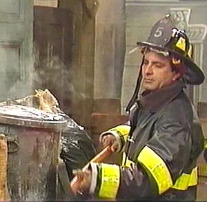 Jesse Corti securing Oscar's trashcan