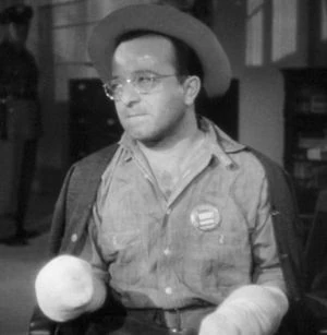 Will Lee, nervously testifying in Saboteur