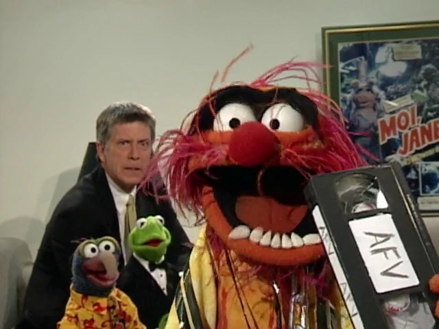 The Muppets with host Tom Bergeron on America's Funniest Home Videos.