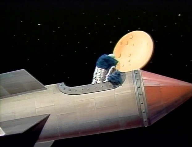 Cookie Monster eats the moon.
