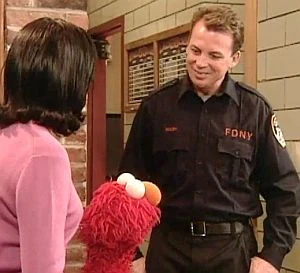 Bil Walsh shows Maria and Elmo around