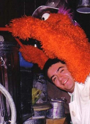 Alejandro Benitez, beneath a Plaza Sesamo drummer
