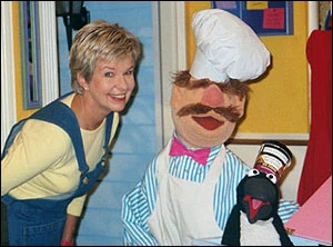Donna with The Swedish Chef and a penguin.