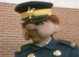 Inspector Farquar takes a local television interview